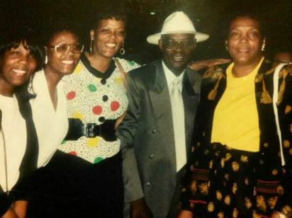 A photograph of Kimyatta Frazier with her family members